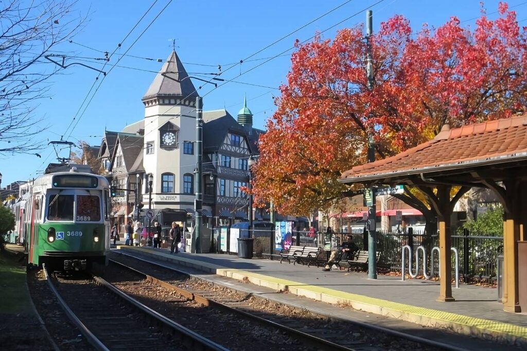 The train passing the clocktower building and station near Brookline, Massachusetts (MA)