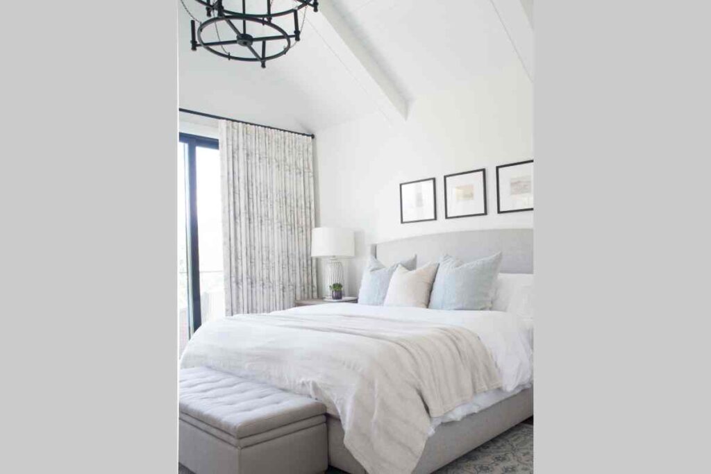 A neutral bedroom with a sheer curtain and custom drapery near Natick, Massachusetts (MA)