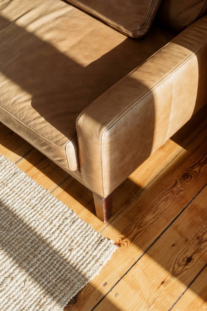 A Reupholstered brown leather chair near an area rug near Sherborn, Massachusetts (MA)